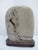 Chinese dream stone or siltstone boulder with custom carved wood stand. Siltstone (or "grass and flower stone") boulders,...