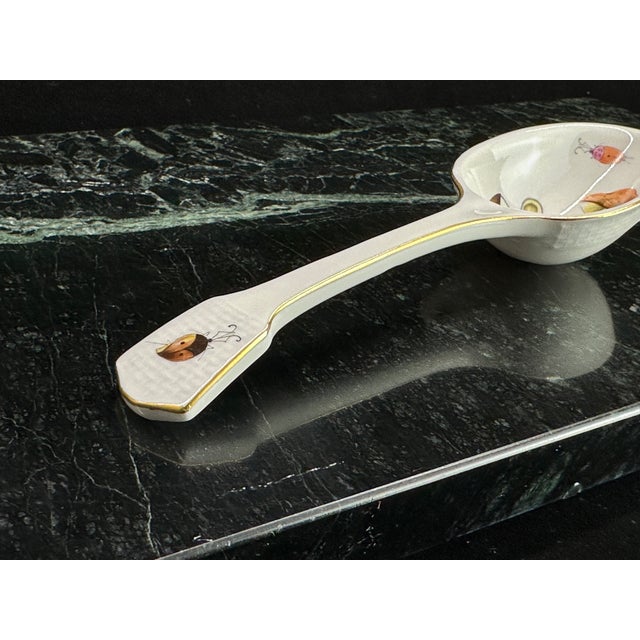 Herend (Hungary) hand-painted porcelain serving spoon with a whimsical woodland motif of mushrooms, a moth, and a ladybug,...