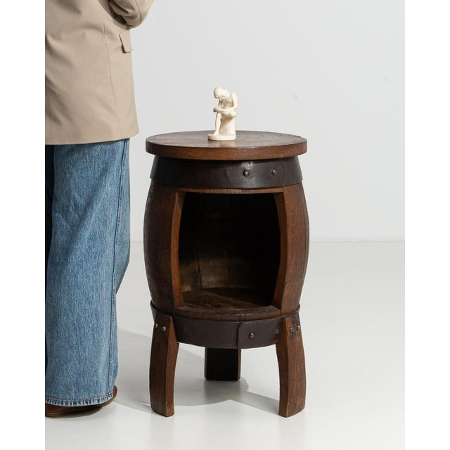 This piece presents as a piece, distinguished by dark aged wood, round tufted seat. It was made in France during Early...