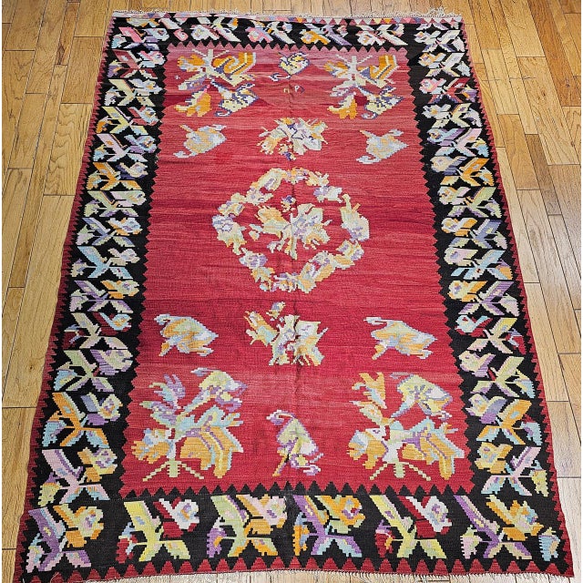 An early 20th century Caucasian Karabagh handwoven kilim rug of exceptional vitality and color. This room-size flatwoven...