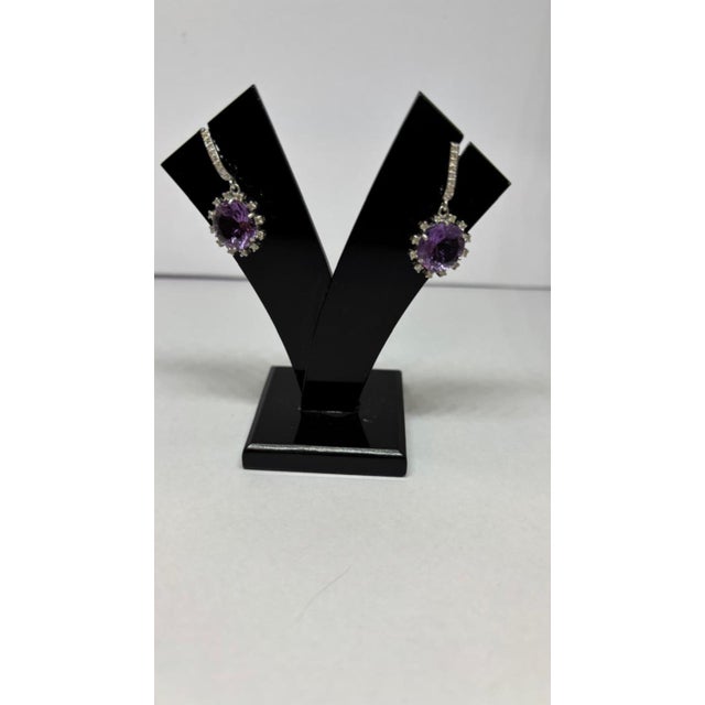 Gemstone details Diamond weight: 0.41cts Amethyst weight: 6.06cts 14K gold Gross weight: 3.96 grams Gold weight: 2.66...