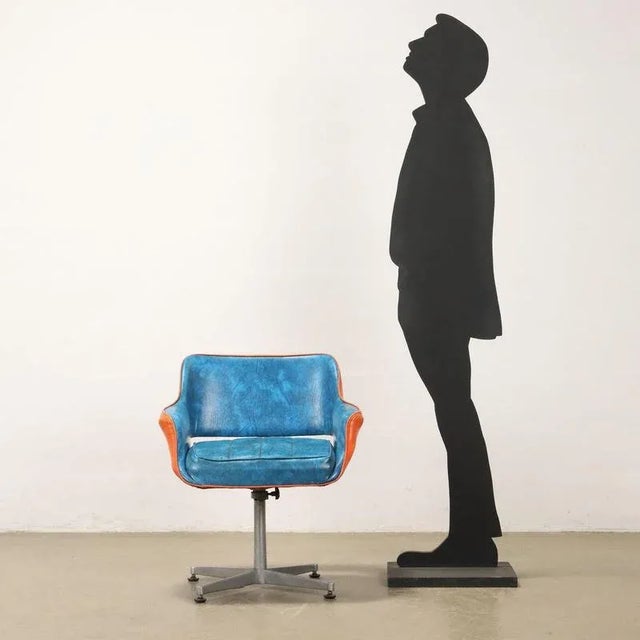Swivel and height-adjustable armchair with aluminum base, foam padding, imitation leather upholstery. This piece is...