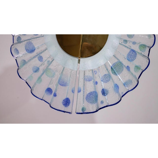 Stunning murano glass chandelier formed by two panes of glass with a fan shape. Height: 90 centimeters Diameter: 58...