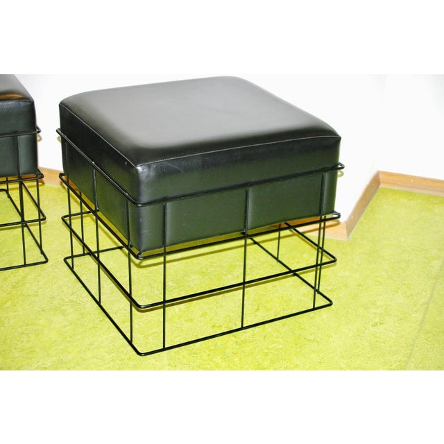 Pair of wire pouf stools with ski seats, 1950s, in good condition This piece is attributed to the mentioned...