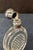 This vintage Continental 19th century scent bottle is designed in silver & crystal. Its unique shape exhibits a sparkling...