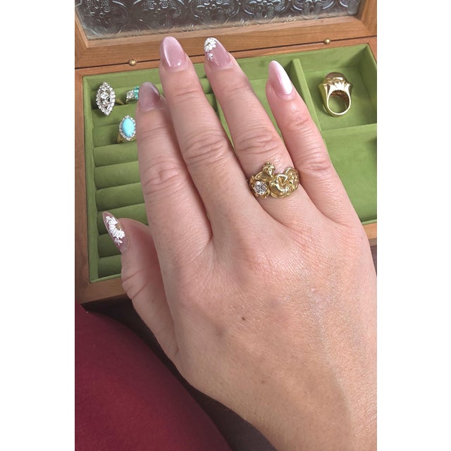 We offer free 2-day shipping! This is an art nouveau ring featuring a female nymph reclining on a diamond with lovely...