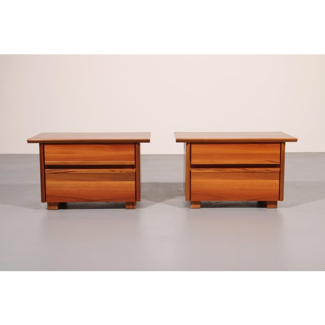 Bring the warm sophistication of 1970s Italian design into your home with this beautiful pair of bedside tables, crafted...