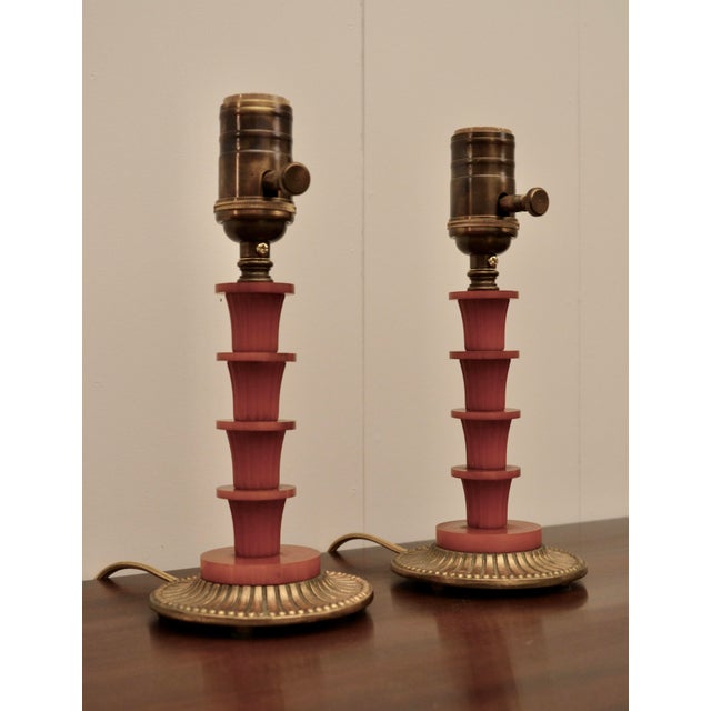 A unique pair of Bakelite accent lamps on gilded metal bases. Classically inspired shapes and detailing with Art Deco /...