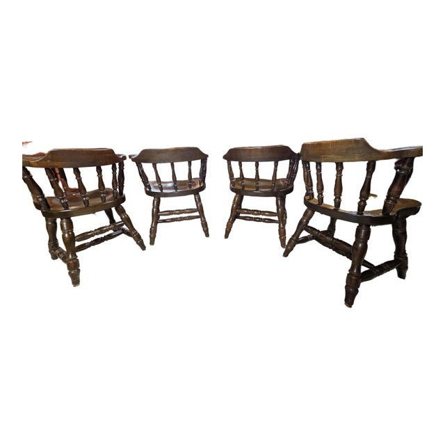 Elevate your dining space with this exceptional, matching set of four mid-century dining chairs crafted by the historic...