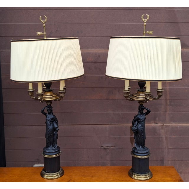 A pair of late 20th century Napoleon III style gilt and patinated bronze figural seven-light candelabra attributed to Paul...