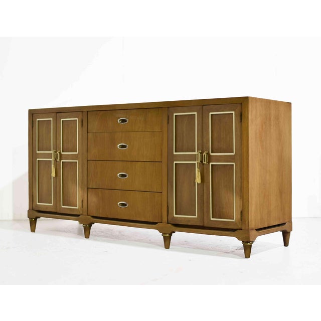 A classic silhouette with a fresh, elevated feel. This Mid Century Modern Sideboard or Dresser by American of Martinsville...
