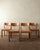 A vintage mid-century dining chair set in solid elm and rush, made by maison regain in france during the 1970s. This set...