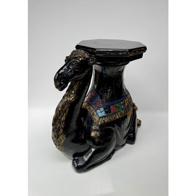 Large camel-form pedestal table made by Florentine Art Studio in 1975. The hollow cast plaster or chalkware body has a...