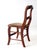 This antique Victorian American dining chair features a curving ladder back, turned legs, and a floral tapestry seat. Its...