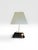 An elegant vintage Toyo Japan table lamp featuring a striking high-gloss black lacquer waterfall base paired with a...