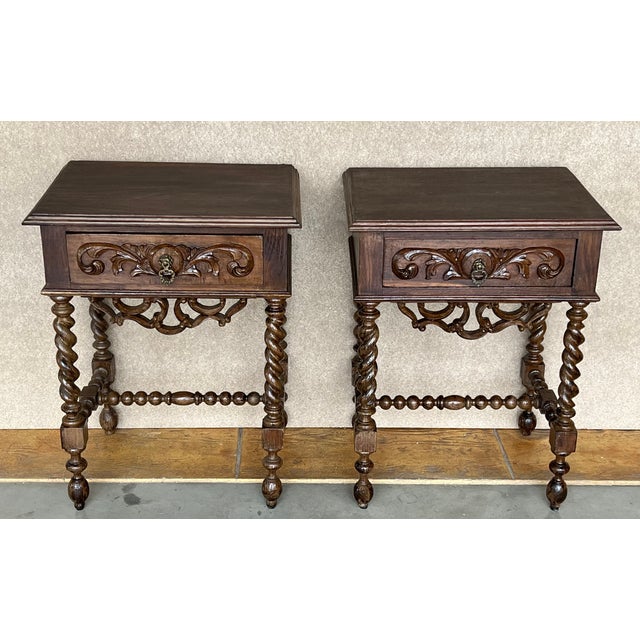 20th Century pair of solid carved French nightstands with turned columns and stretcher. It has one carved drawer with...