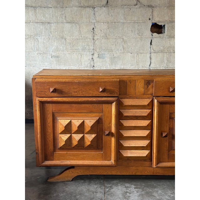 Statement brutalist sideboard in blonde oak by innovative French designer Charles Dudouyt. Not signed.
