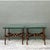 This pair of vintage Brutalist side tables pairs clear glass tops with intricately worked gilt-metal bases, each supported...