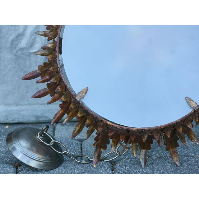 A Spanish gilt metal semi-flush crown chandelier from the Midcentury period with three-tiered foliage and frosted glass...