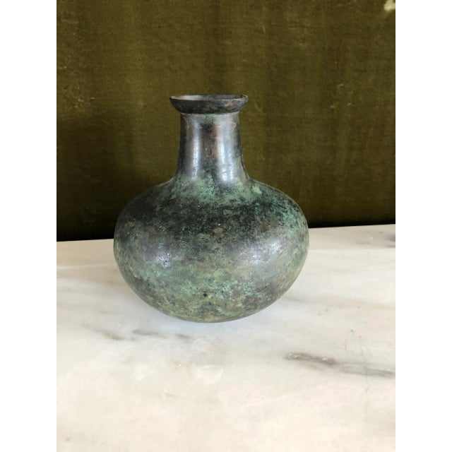 Vase in a globular form with a mottled, watermelon green patina. Of cast bronze with an applied, irregular, yaki-urushi or...