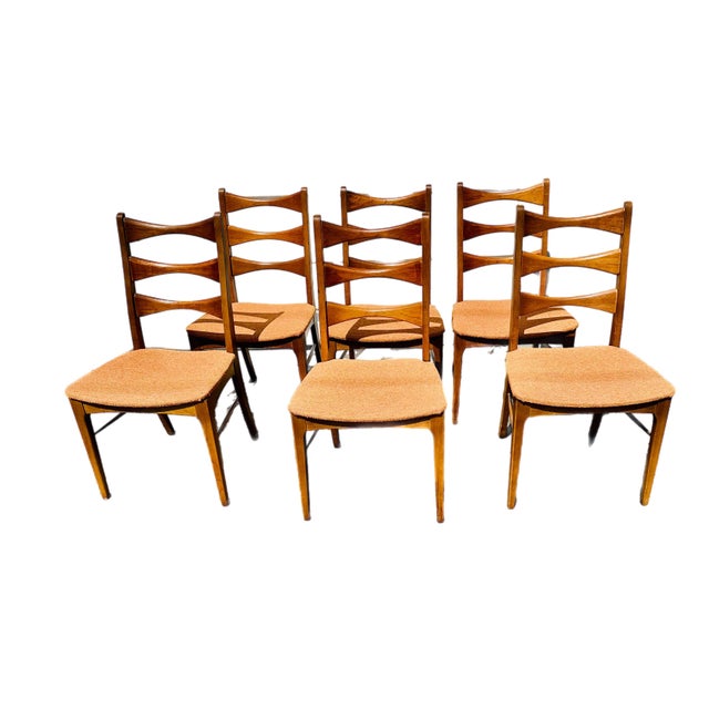 Set of six armless walnut dining chairs by Lane Furniture in the 1960's. The set is a part of Lane’s Rhythm Collection....