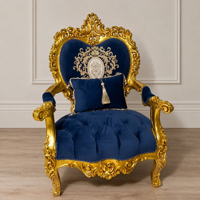Make a statement with this grand French Rococo armchair, featuring luxurious deep blue velvet upholstery and an...