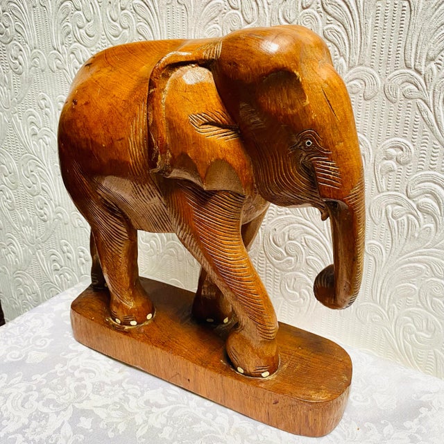 Beautiful large carved mid century teakwood elephant. Painted toes.