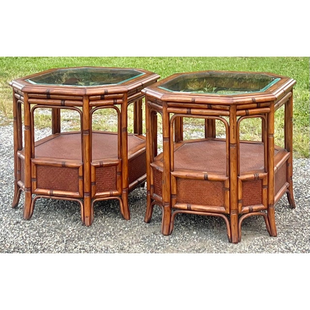 Great pair of palm beach regency faux bamboo and rattan side tables. These coastal chic tables are octagonal in shape with...
