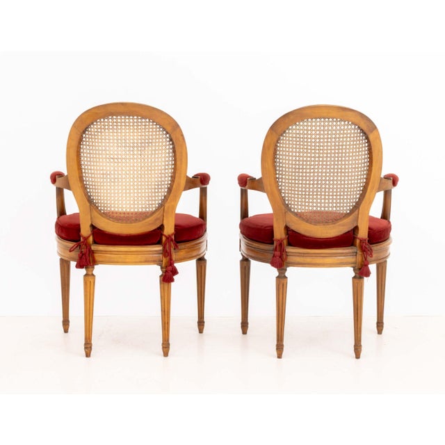 French Pair of Louis XVI Style Red Velvet Upholstered Cane Paneled Walnut Fauteuils For Sale - Image 3 of 13