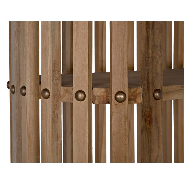 A dazzling display of design virtuosity, the artisan crafted Small Opal Bookcase features teak wood and a natural finish...