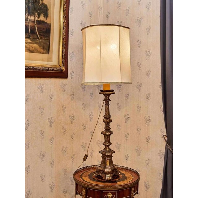 High table lamp, originally a candlestick. The body of the lamp is hand-carved from solid linden wood. Beautiful patina....