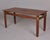 Found in Italy, this mahogany and brass dining table dates from the 1970s. Table features nicely figured top with...
