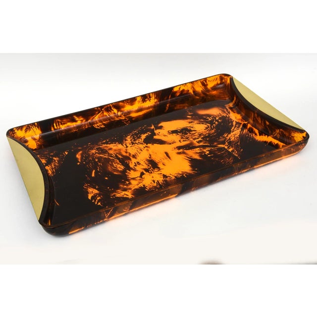 This vintage Italian Rede Guzzini faux tortoise lucite tray with brass handles has been professionally polished and makes...