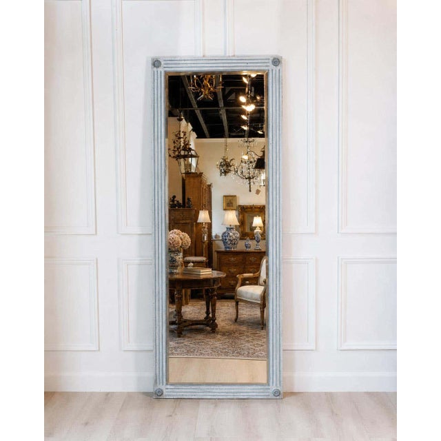 An impressive Italian painted mirror dating to the 19th century and inspired by the refined elegance of the Napoleon III...