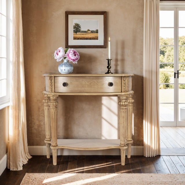 This elegant console table has a relaxed traditional aesthetic. Crafted from select hardwood solids and wood products, Its...