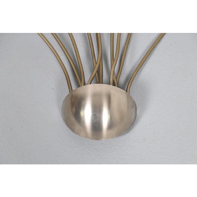 The Exis wall sconce, often affectionately called “Medusa” due to its distinctive shape, is a striking example of Florian...