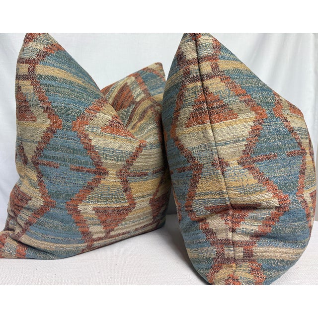 Custom pair of 22" pillows covered in a ikat patterned woven fabric. These pillows have tapered corners to prevent dog...