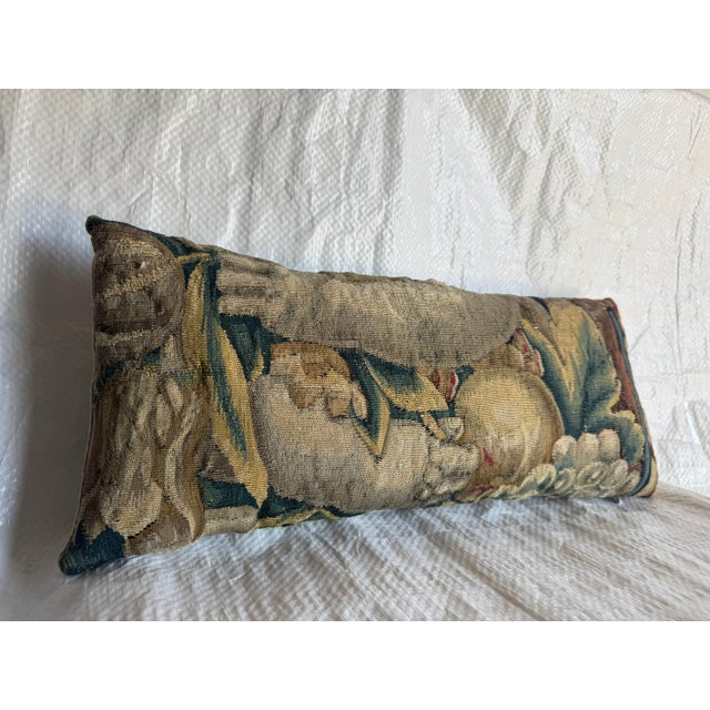 An exceptional 16th Century Flemish Brussels tapestry pillow woven in wool and silk, featuring architectural and botanical...