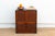 This charming antique Japanese tansu chest, crafted with a faux bamboo texture embodies the elegance and ingenuity of...