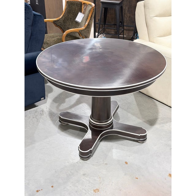 This is a beautifully proportioned Hickory Chair Hudson center table featuring a 42 inch round top finished in a rich dark...