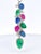 A vibrant tutti-frutti style pendant featuring an alternating cascade of hand-carved sapphires, emeralds, and rubies, each...
