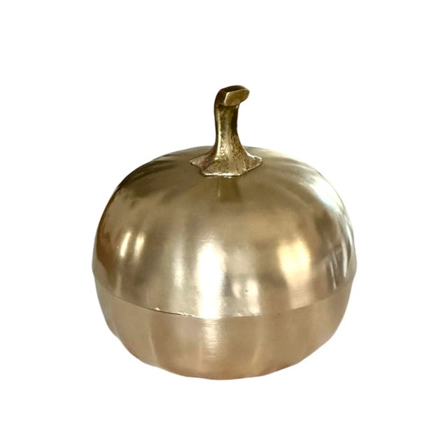 A charming, vintage brass lidded box in the form of a pumpkin. Features a solid brass body cast in the form of a pumpkin,...