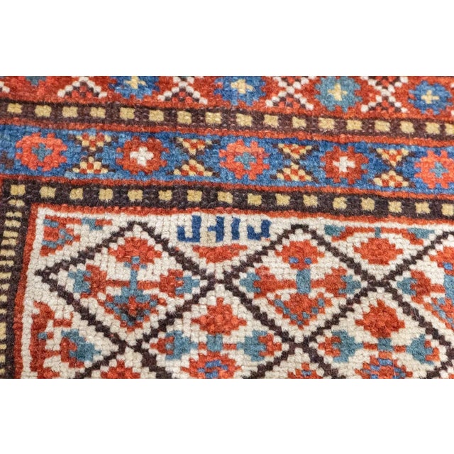 The dark blue Herati-pattern sub- field of this SW Persian tribal scatter hosts a similar-pattern stepped hexagonal...
