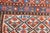 The dark blue Herati-pattern sub- field of this SW Persian tribal scatter hosts a similar-pattern stepped hexagonal...