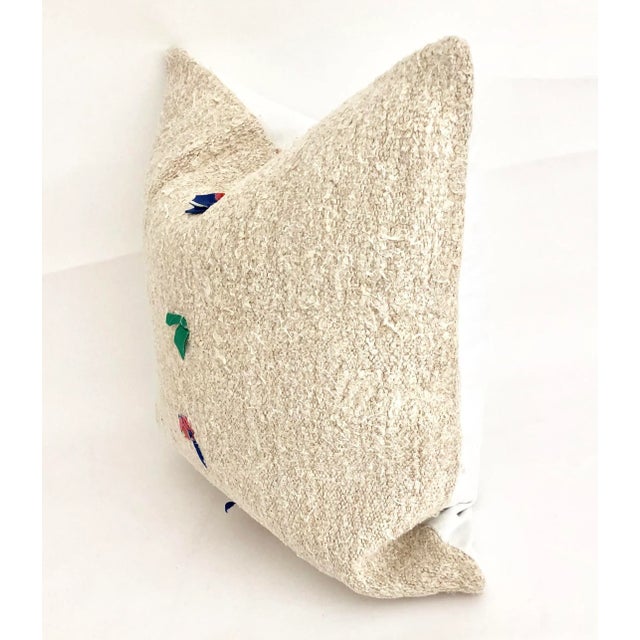 These Turkish hemp pillows have a wonderful texture and a nice hand. This particular pillow features snippets of fabric...