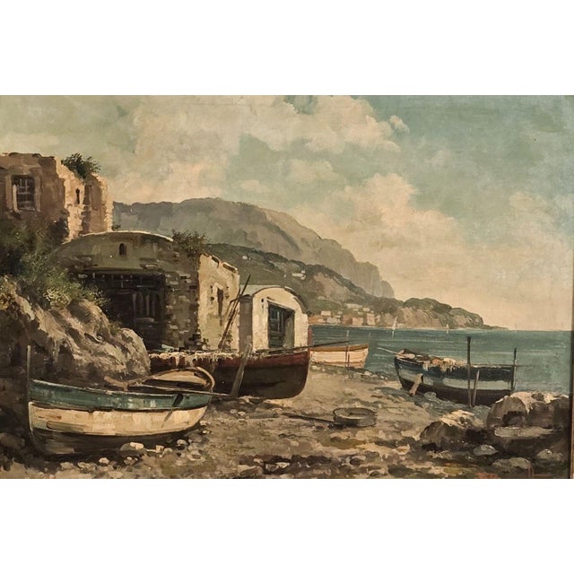 A Continental oil painting of a fishing village, probably Italy circa 1900.