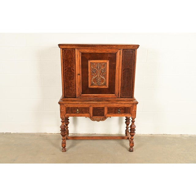 An exceptional antique English Jacobean style bar cabinet By Batesville Cabinet Co. (early Romweber) USA, Circa 1900...