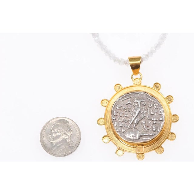 This is part of Chairish’s Fine Jewelry assortment. An authentic Greek, Athens silver tetradrachm coin of Athena and Owl...