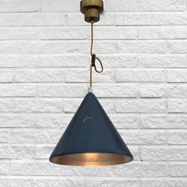 Swedish mid-century cone-shaped pendant lamp with intricate star constellations and a crescent moon perforated in the...