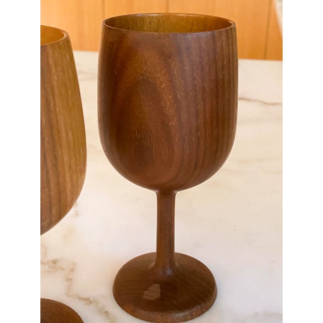 A set of four Hand turned wood goblets - Made in 1976 by Burt Richardson the mouth opening is 2.25 Inches Wide The foot to...